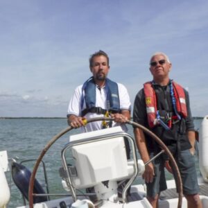 David supervising VI sailor Dan on the helm