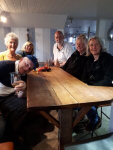 Crew at the lightship bar, seated around table, Sue, Alan, Diane, Lorraine along with sighted crew Billy & Karen