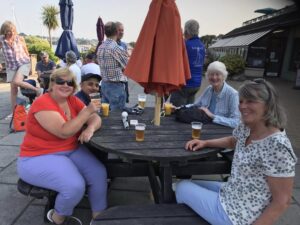 Drinks ashore, crew of Anita's yacht enjoying refreshments, seated at the round table are skipper Rosie, Vjay, Anita and Julia.  Behind are other members of crew from the other Visa-gb yachts.